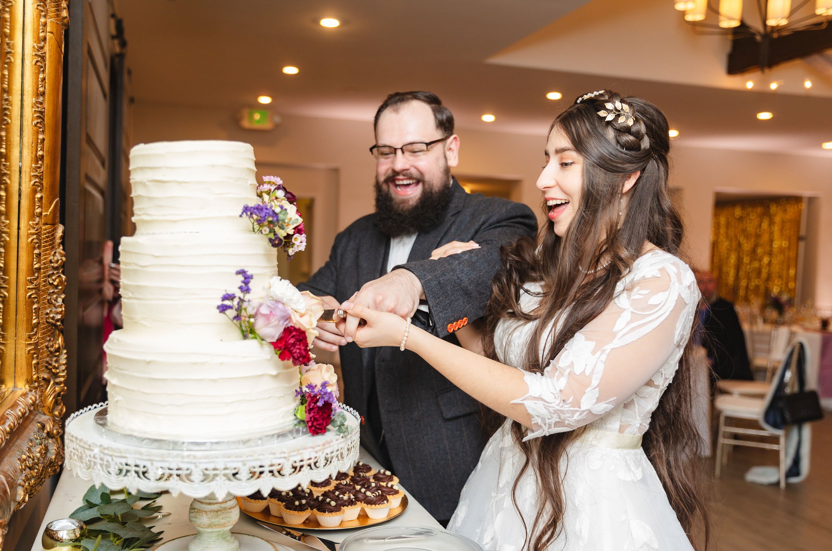 Bride and Groom Cutting Cake at Sequoia Mansion by Wedgewood Weddings