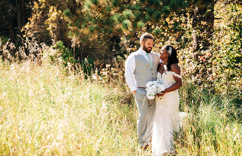 Bride and groom in meadow - Boulder Creek by Wedgewood Weddings