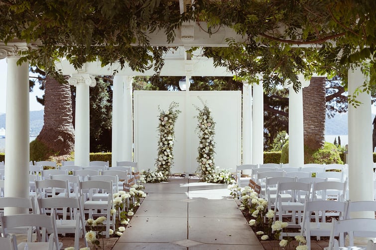 Ceremony site with floral arch - Jefferson Street Mansion by Wedgewood Weddings