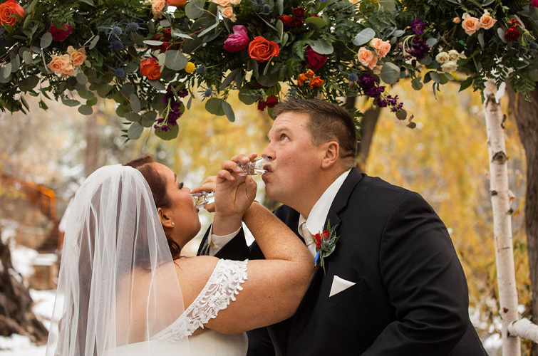 Couple doing a tequila shot unity ceremony - Boulder Creek by Wedgewood Weddings