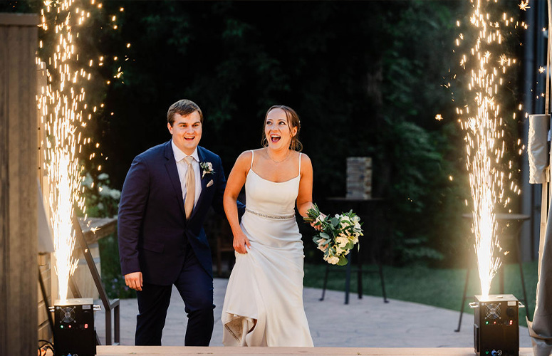 Couple entering in for grand sparkler moment - Boulder Creek by Wedgewood Weddings