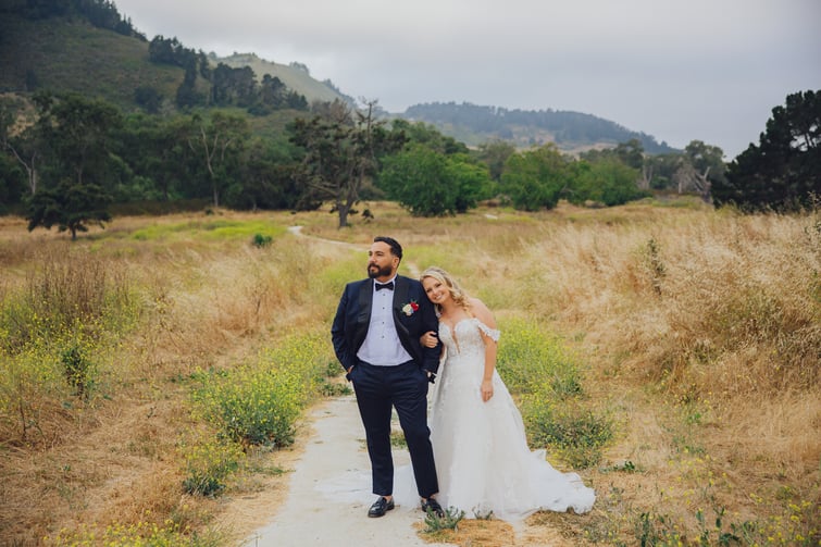 Couple in beautiful field at Carmel Fields by Wedgewood Weddings