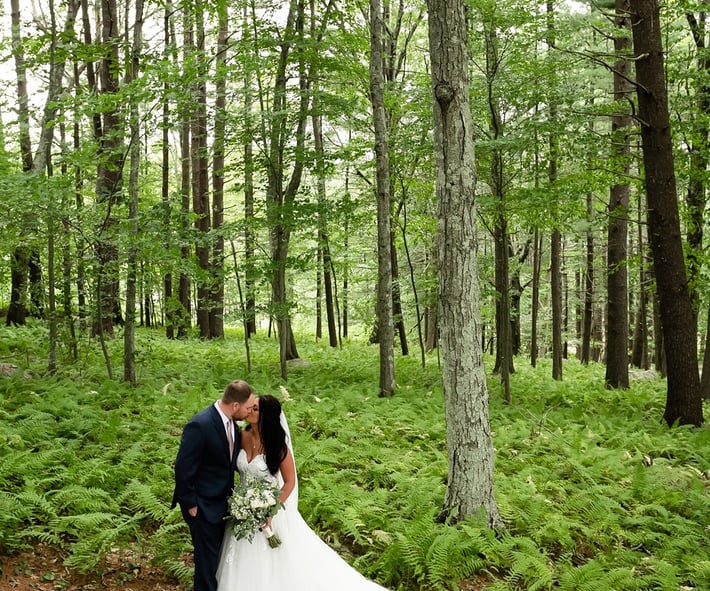 Couple in fern forest, photo op at Fern Hill Barn by Wedgewood Weddings-1