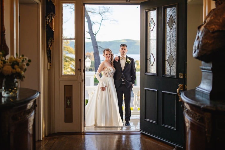 Couple in front door ay Jefferson Street Mansion by Wedgewood Weddings