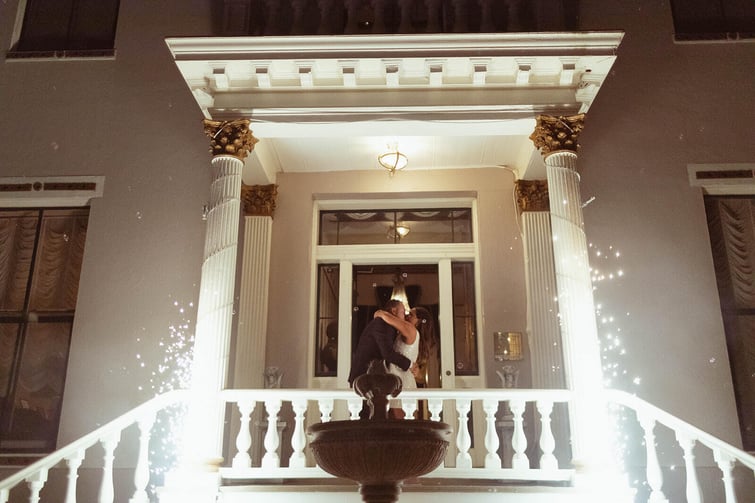 Couple kissing during grand sparkler moment - Jefferson Street Mansion by Wedgewood Weddings