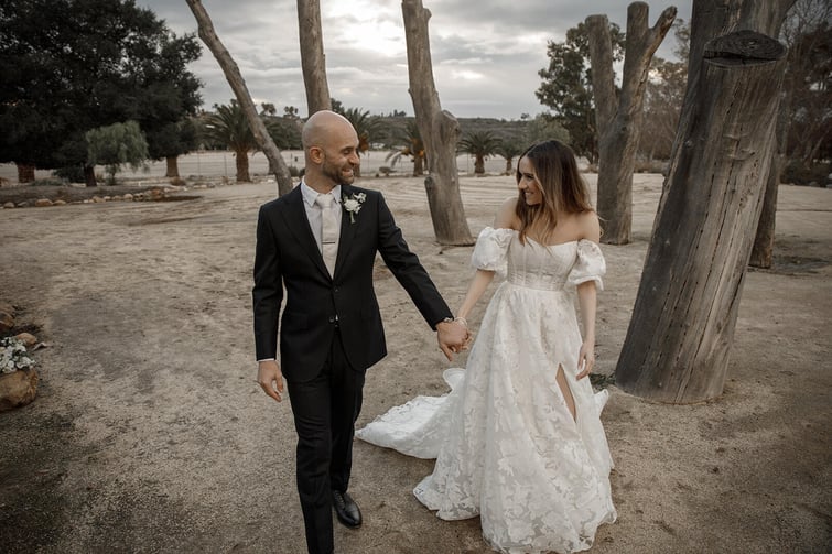 Couple posing among trees at Galway Downs by Wedgewood Weddings