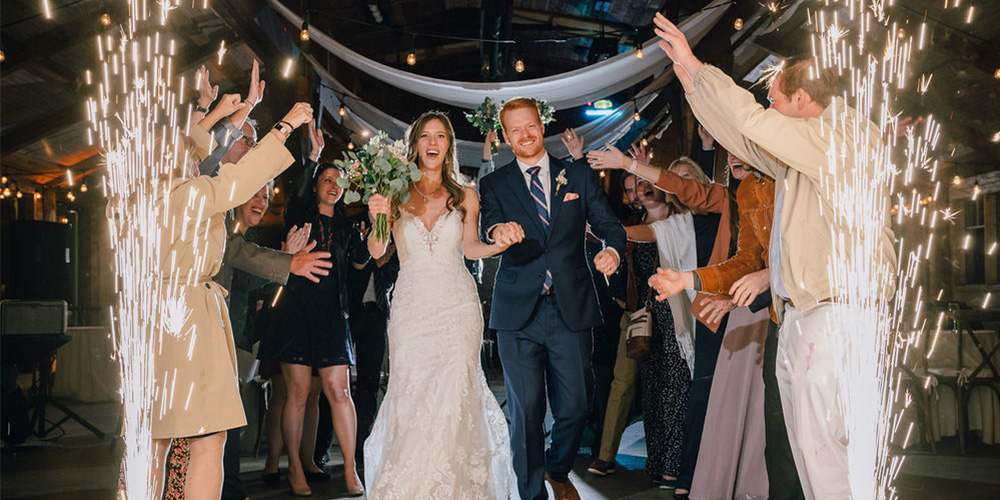 Couple enjoying grand sparkler moment at Mountain View Ranch by Wedgewood Weddings