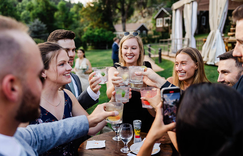 Guests enjoying drinks & cheersing - Boulder Creek by Wedgewood Weddings