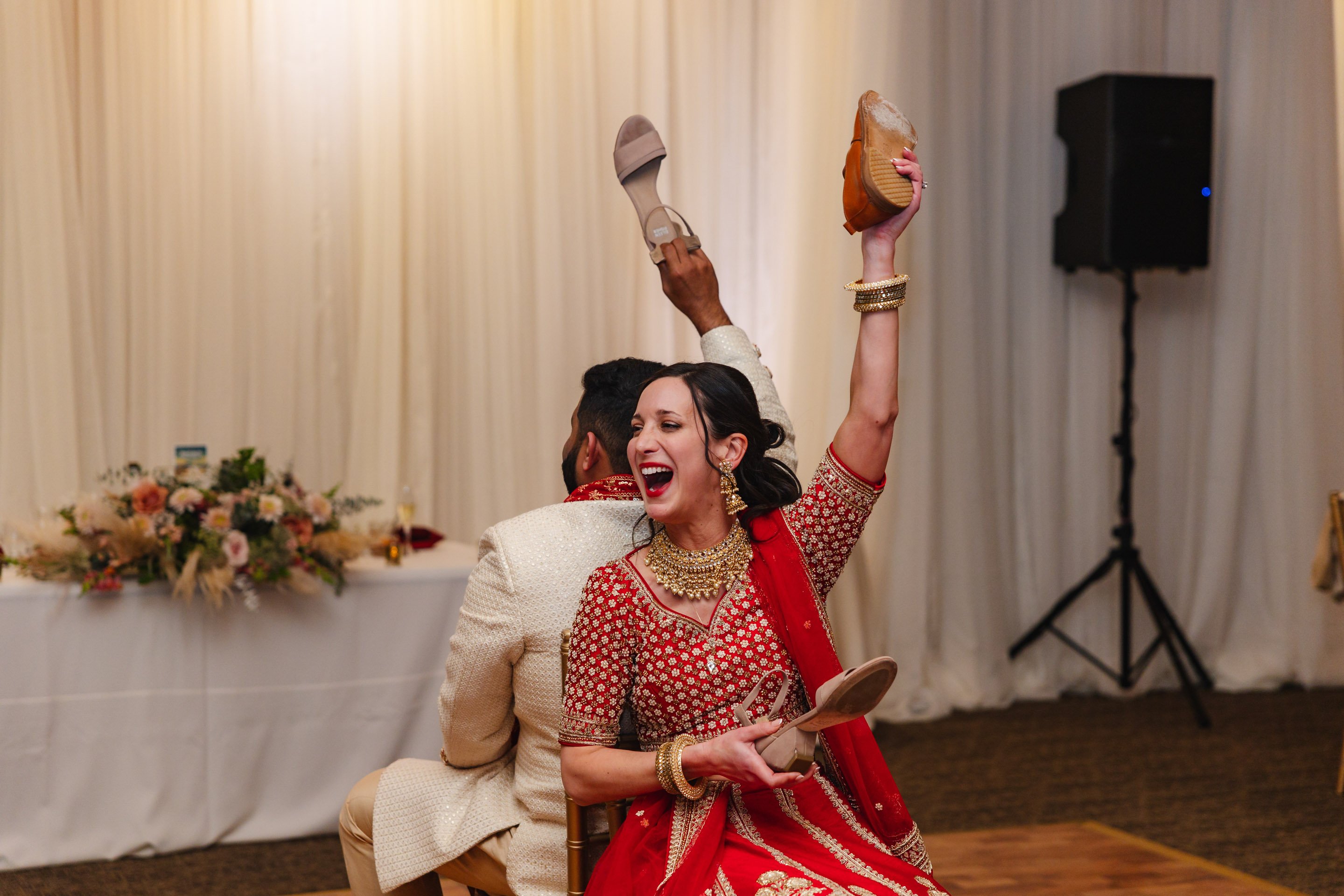 Newlyweds Playing the Shoe Game at Stonetree Estate by Wedgewood Weddings