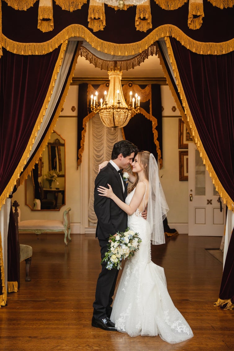 Newlyweds among dramatic historic interior of Jefferson Street Mansion by Wedgewood Weddings