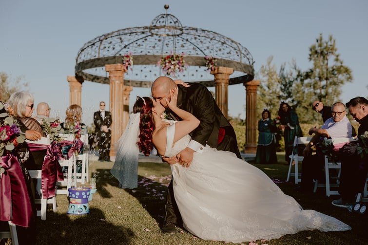 Newlyweds sharing first kiss - Vellano Estate by Wedgewood Weddings