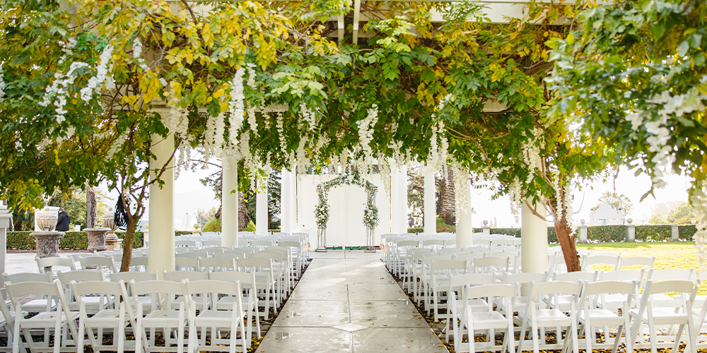 Ceremony site with gorgeous greenery & wisteria - Jefferson Street Mansion by Wedgewood Weddings