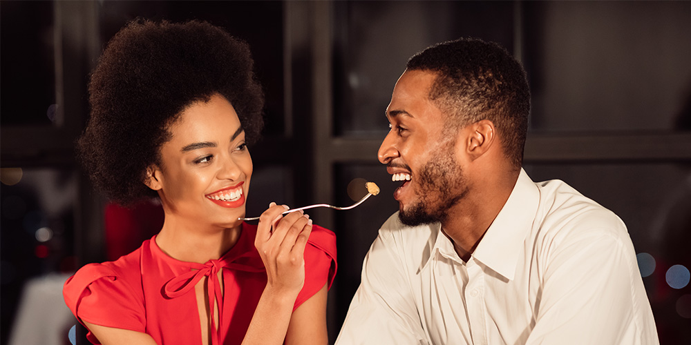 Couple feeding each other