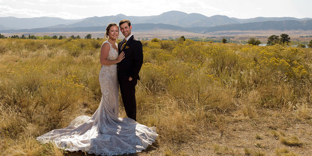 Couple in meadow at Ashley Ridge by Wedgewood Weddings