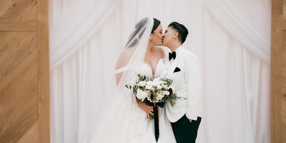 Couple kissing at Carlsbad Windmill by Wedgewood Weddings