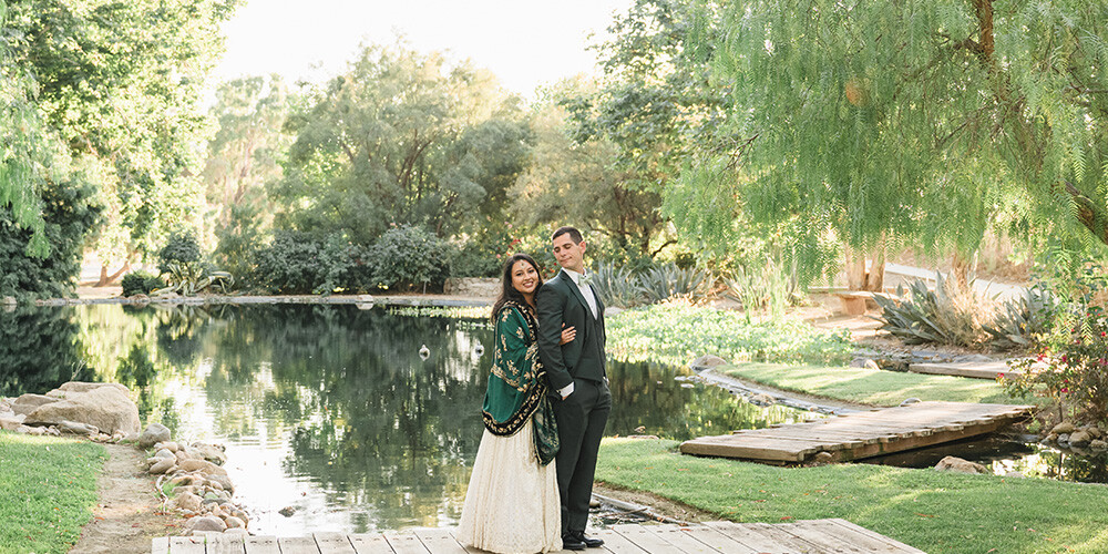 Couple posing among beautiful grounds at Galway Downs by Wedgewood Weddings