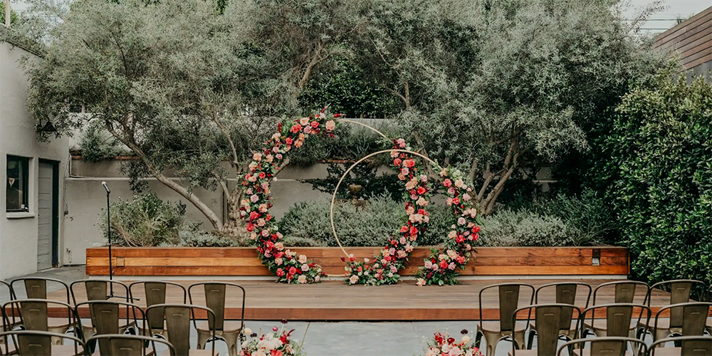 Olive groves with bright florals at The Harper by Wedgewood Weddings