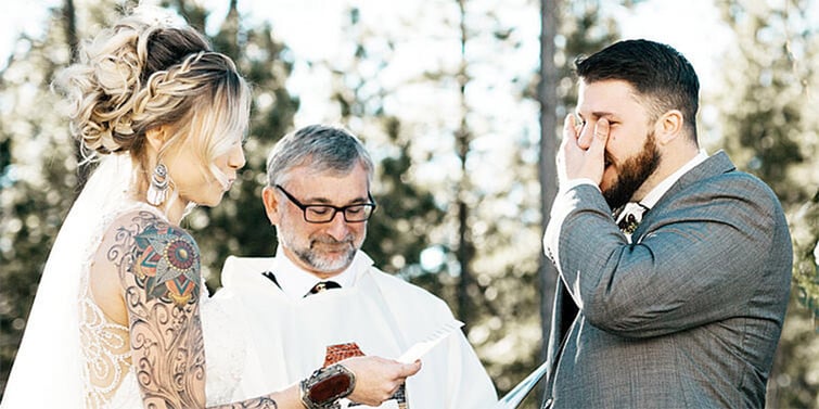 A couple reading their wedding vows