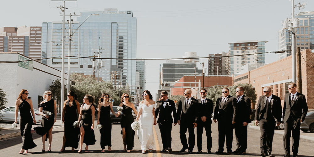 Wedding party walking through downtown Phoenix by Croft Downtown