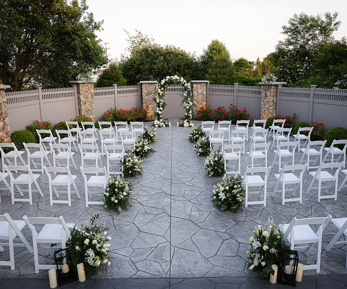 Ceremony Site with Dramatic Florals - Barker House by Wedgewood Weddings