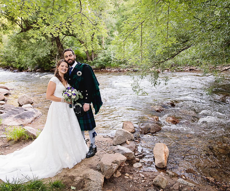 A couple by the creek at Boulder Creek by Wedgewood Weddings