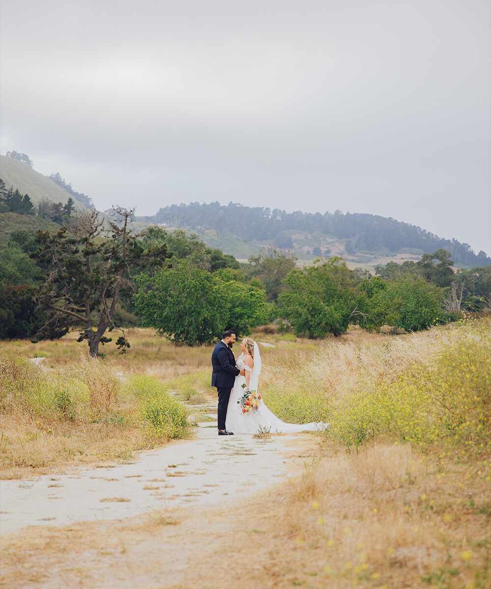 Couple in parkland with hills - Carmel Fields by Wedgewood Weddings