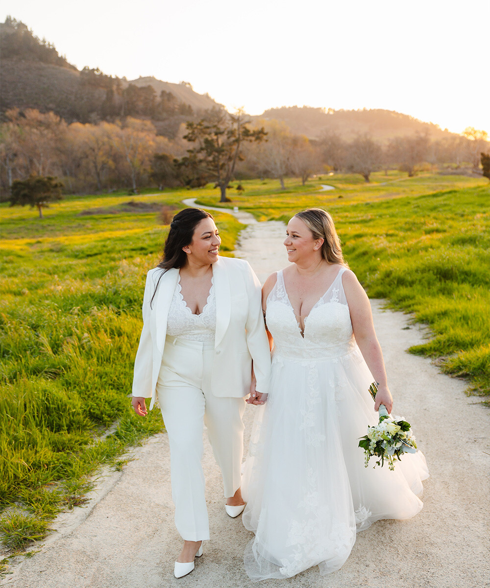 Two brides walking through parkland - Carmel Fields by Wedgewood Weddings