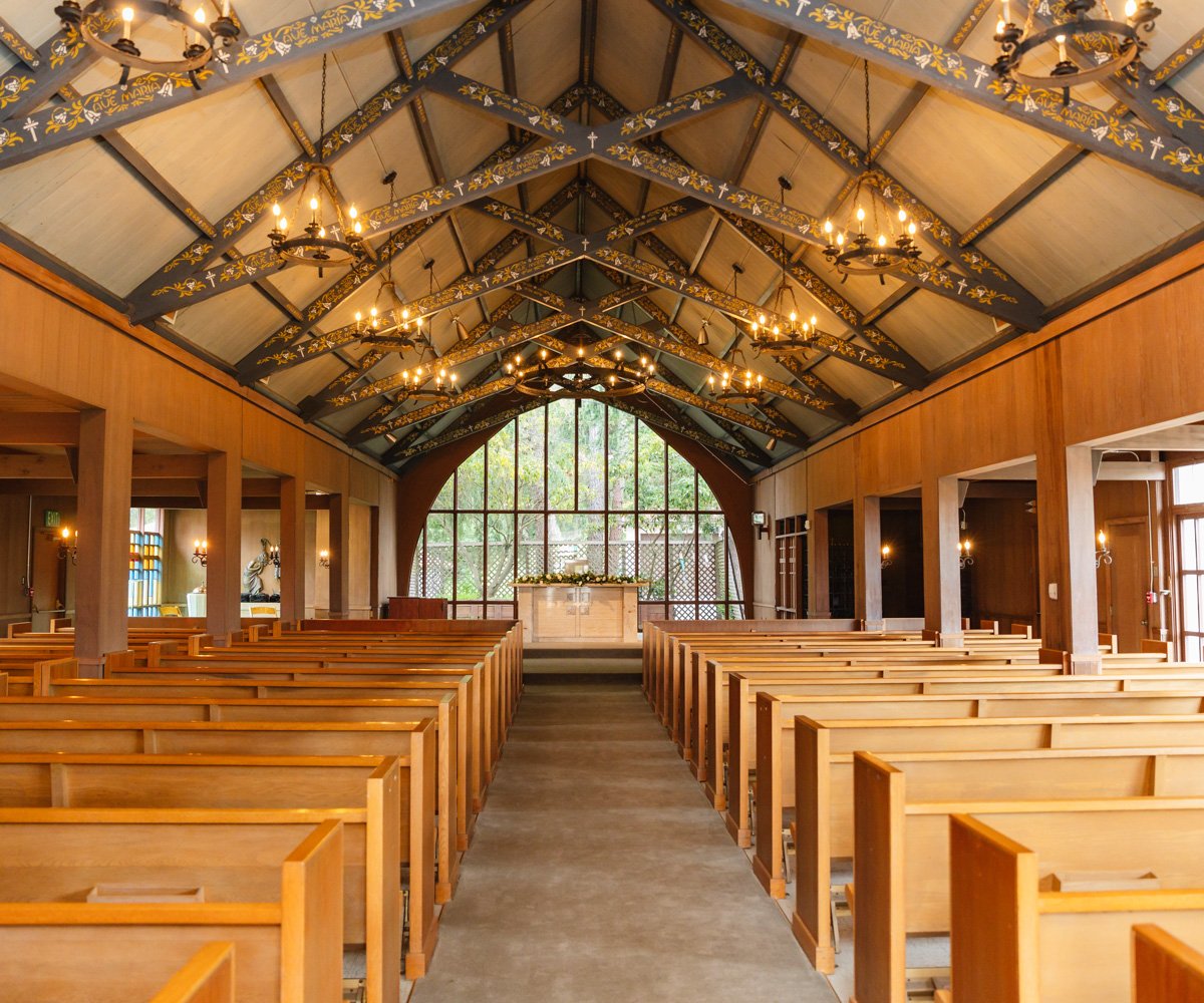 View of the altar at the end of the aisle in historic Bay area church - Chapel of Our Lady at the Presidio - Wedgewood Weddings - 1