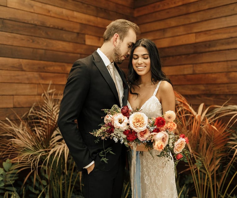 Couple in front of wood wall - Clayton House by Wedgewood Weddings