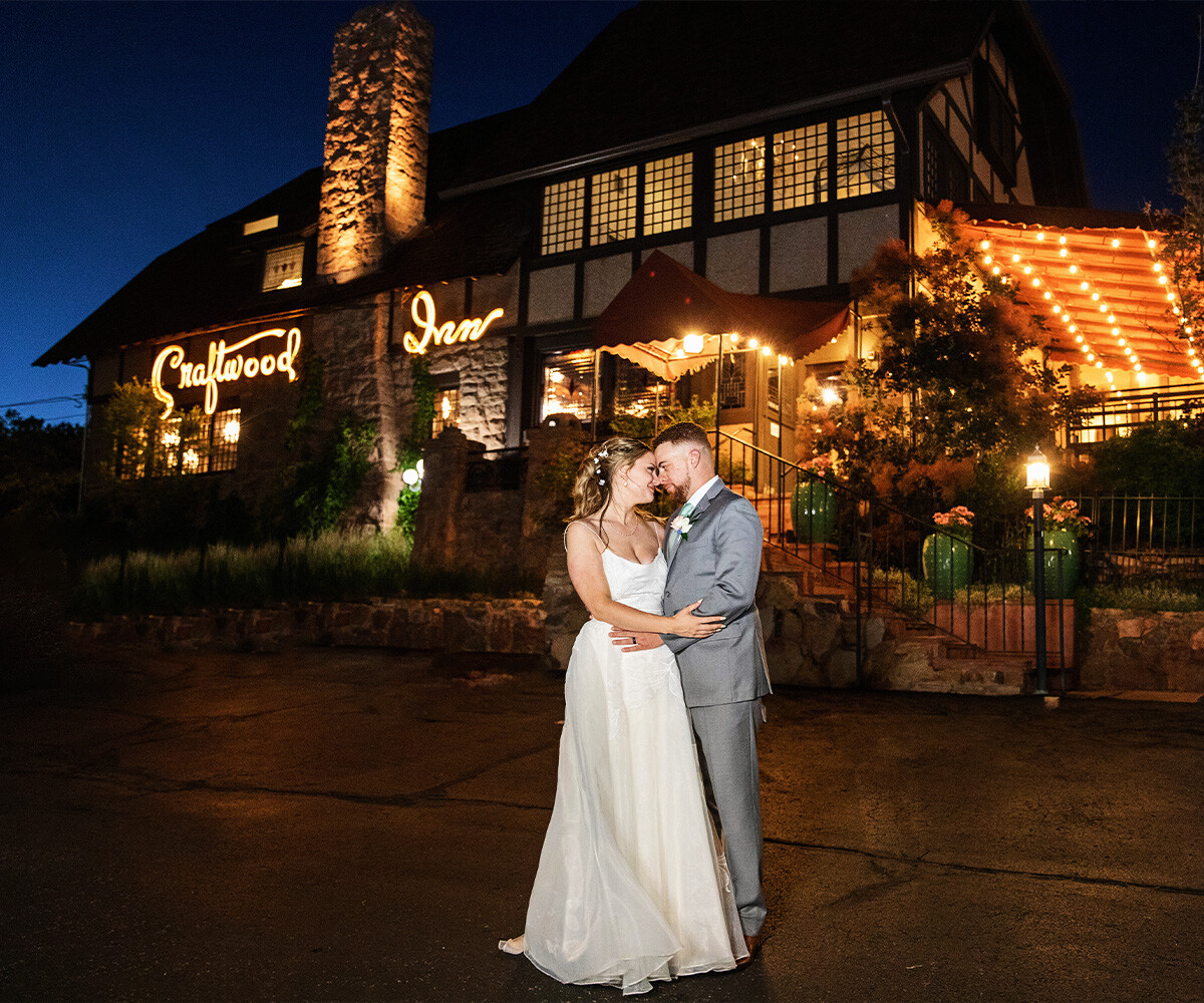 Couple at nighttime in front of Craftwood Peak by Wedgewood Weddings