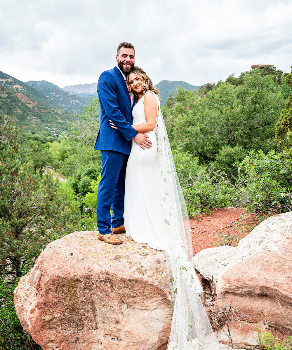 Couple on cliffs with views - Craftwood Peak by Wedgewood Weddings