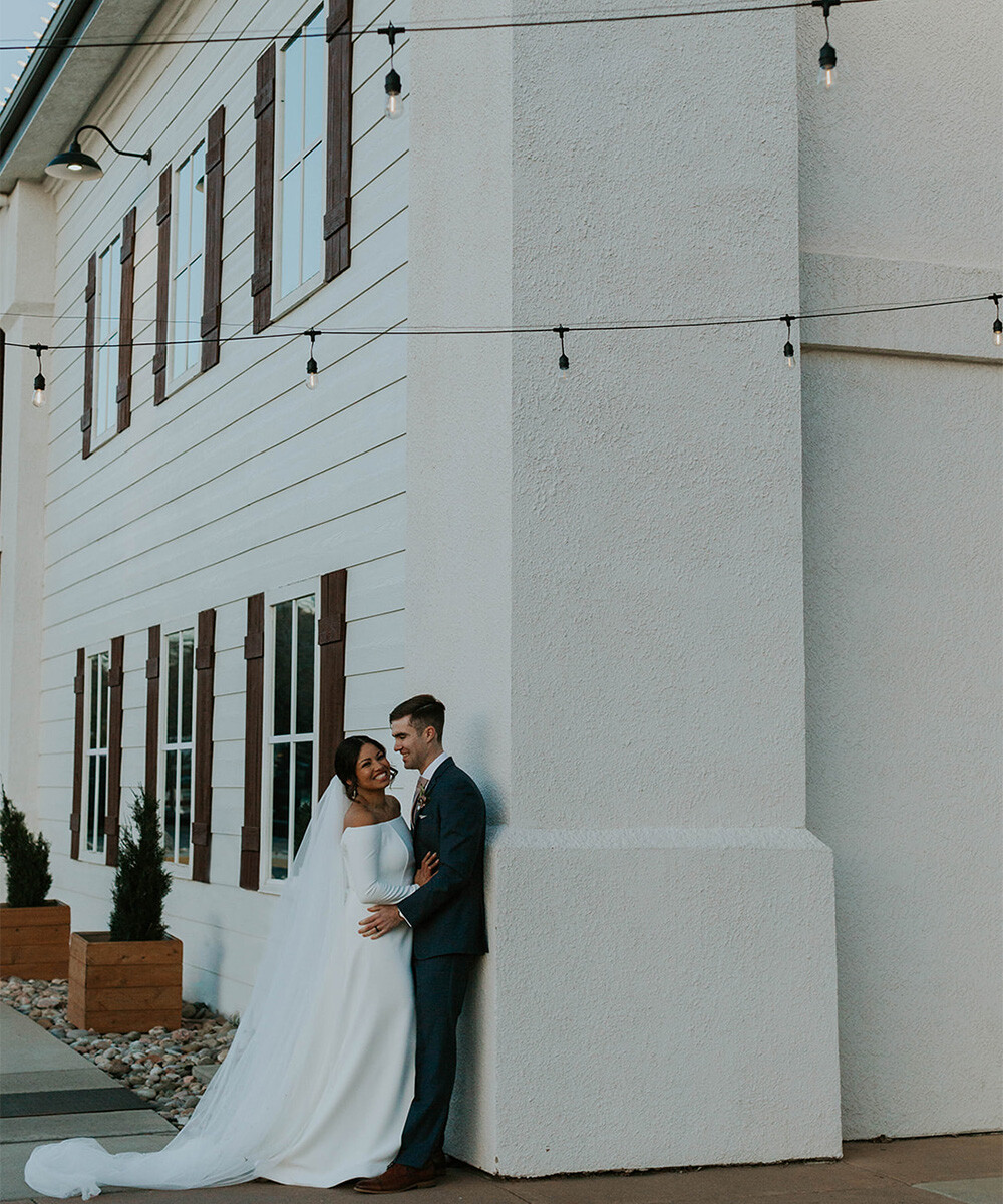 Couple outside exterior of building - Creekside Terrace by Wedgewood Weddings