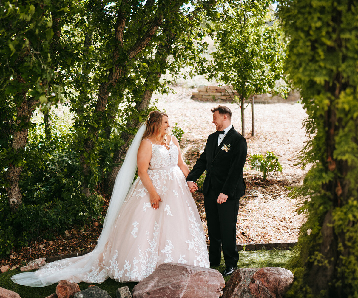 Happy newlyweds laughing outside - Creekside Terrace by Wedgewood Weddings