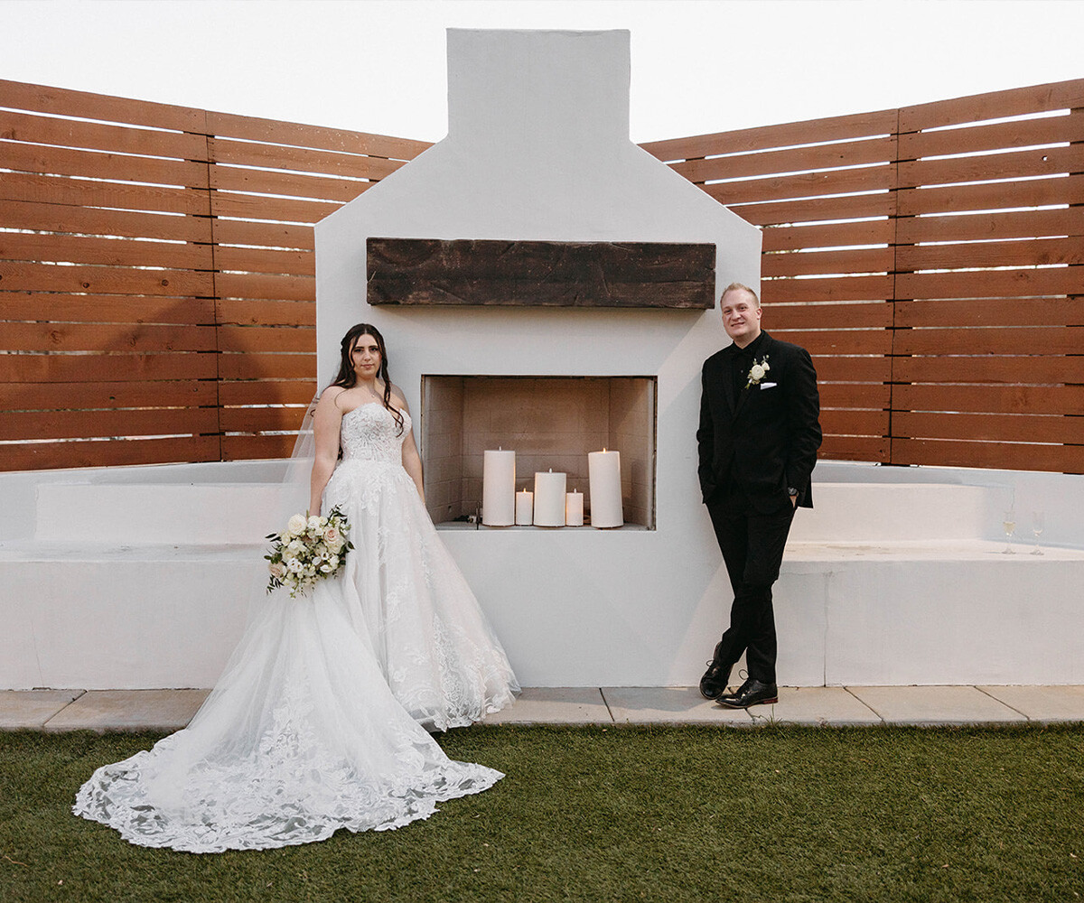 Newlyweds in front of fireplace - Creekside Terrace by Wedgewood Weddings