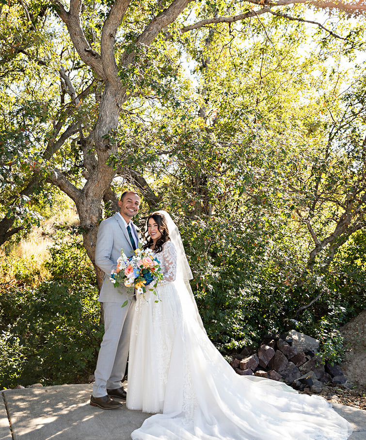 Newlyweds in front of tree - Creekside Terrace by Wedgewood Weddings