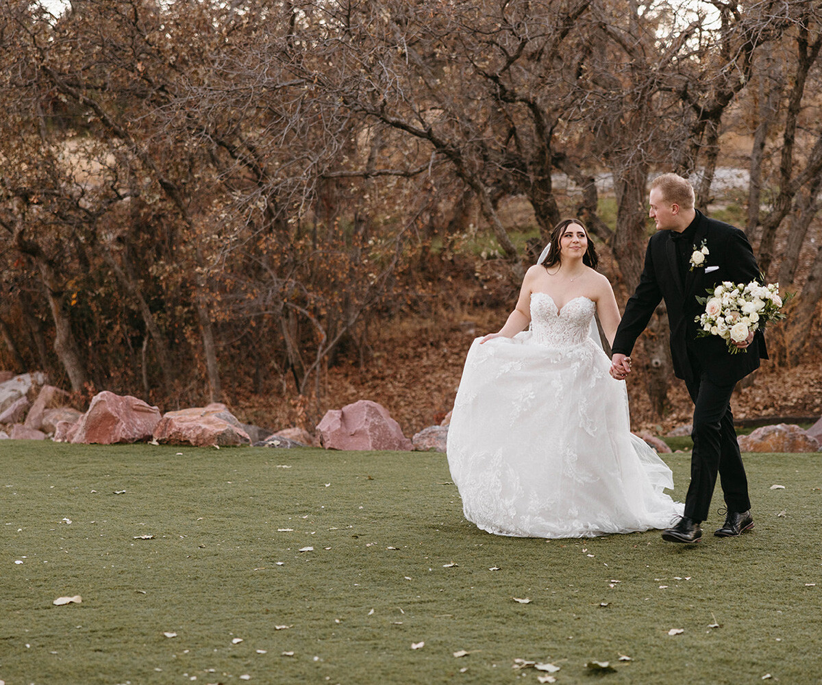 Wedding couple walking through trees - Creekside Terrace by Wedgewood Weddings