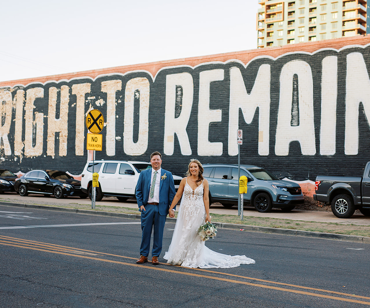 Couple in front of wall mural in Phoenix - Croft Downtown by Wedgewood Weddings