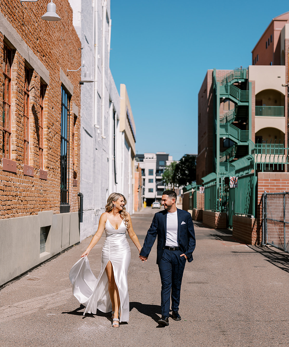 Couple walking through downtown Phoenix - Croft Downtown by Wedgewood Weddings