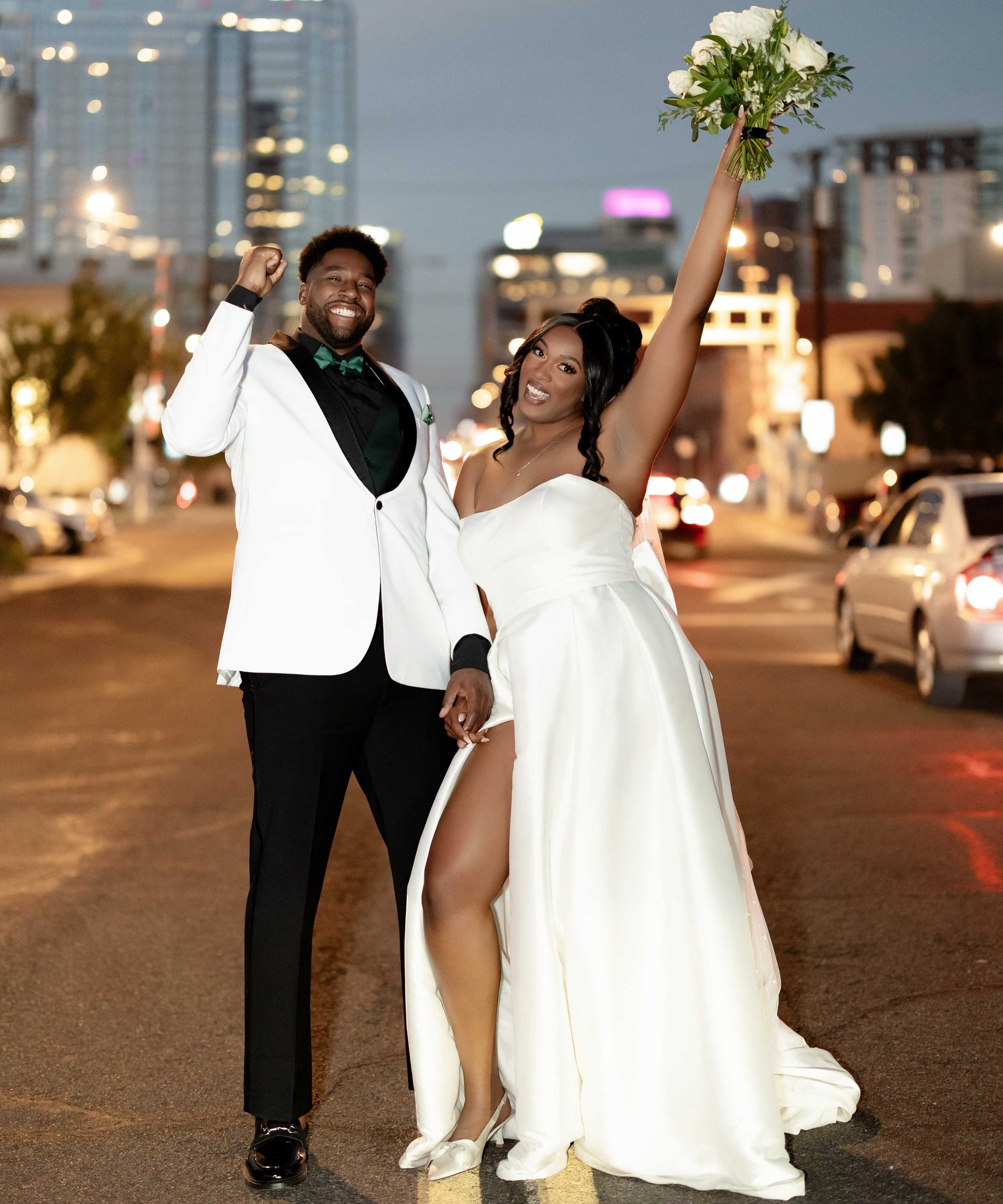 joyful newlyweds celebrating on downtown Phoenix streets at night