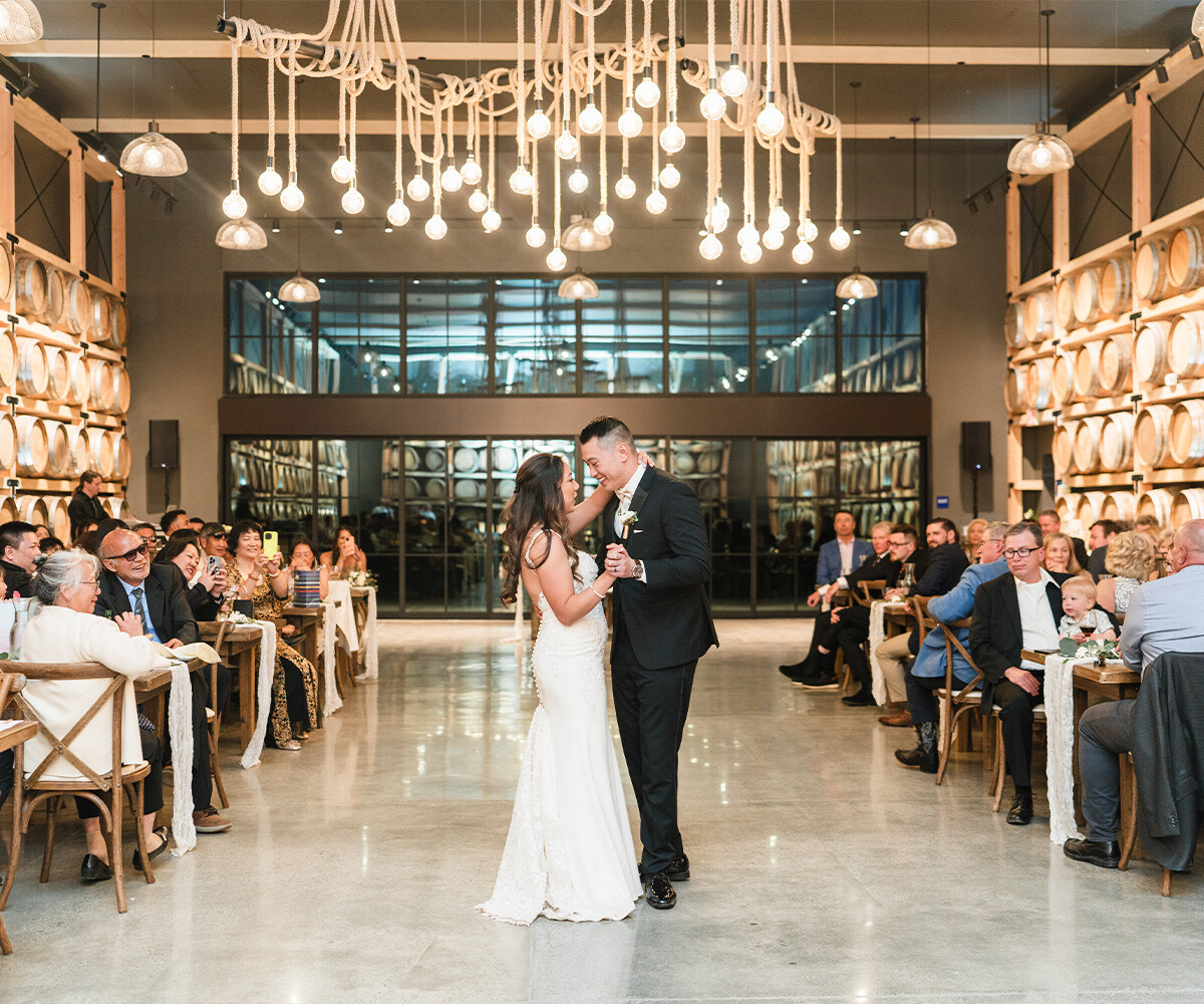 Couple enjoying their first dance - Danza del Sol Winery by Wedgewood Weddings