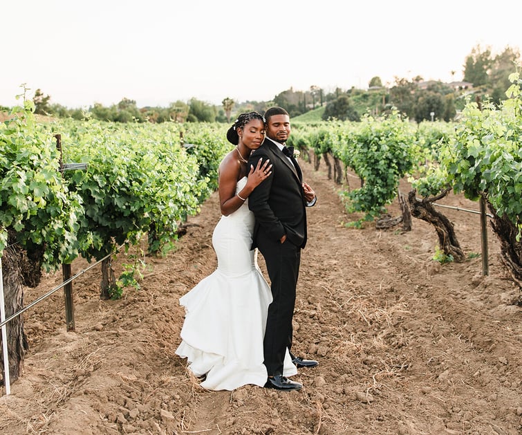 Newlyweds among vineyards at Danza del Sol Winery by Wedgewood Weddings