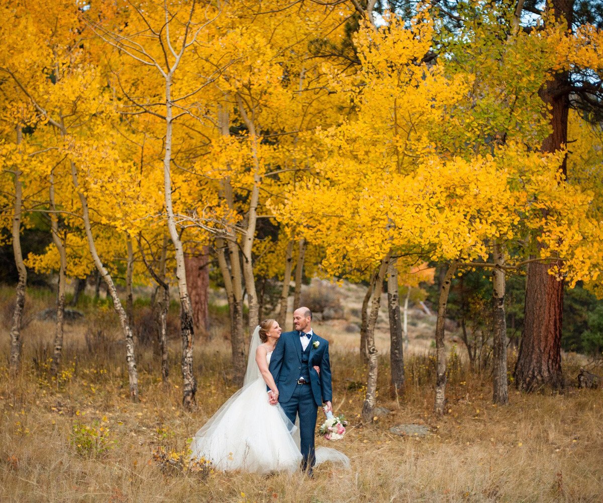 Couple among aspen trees with changing leaves - Della Terra by Wedgewood Weddings