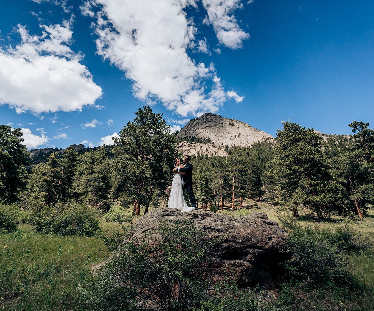 Couple on top of rocks with forest views - Della Terra by Wedgewood Weddings