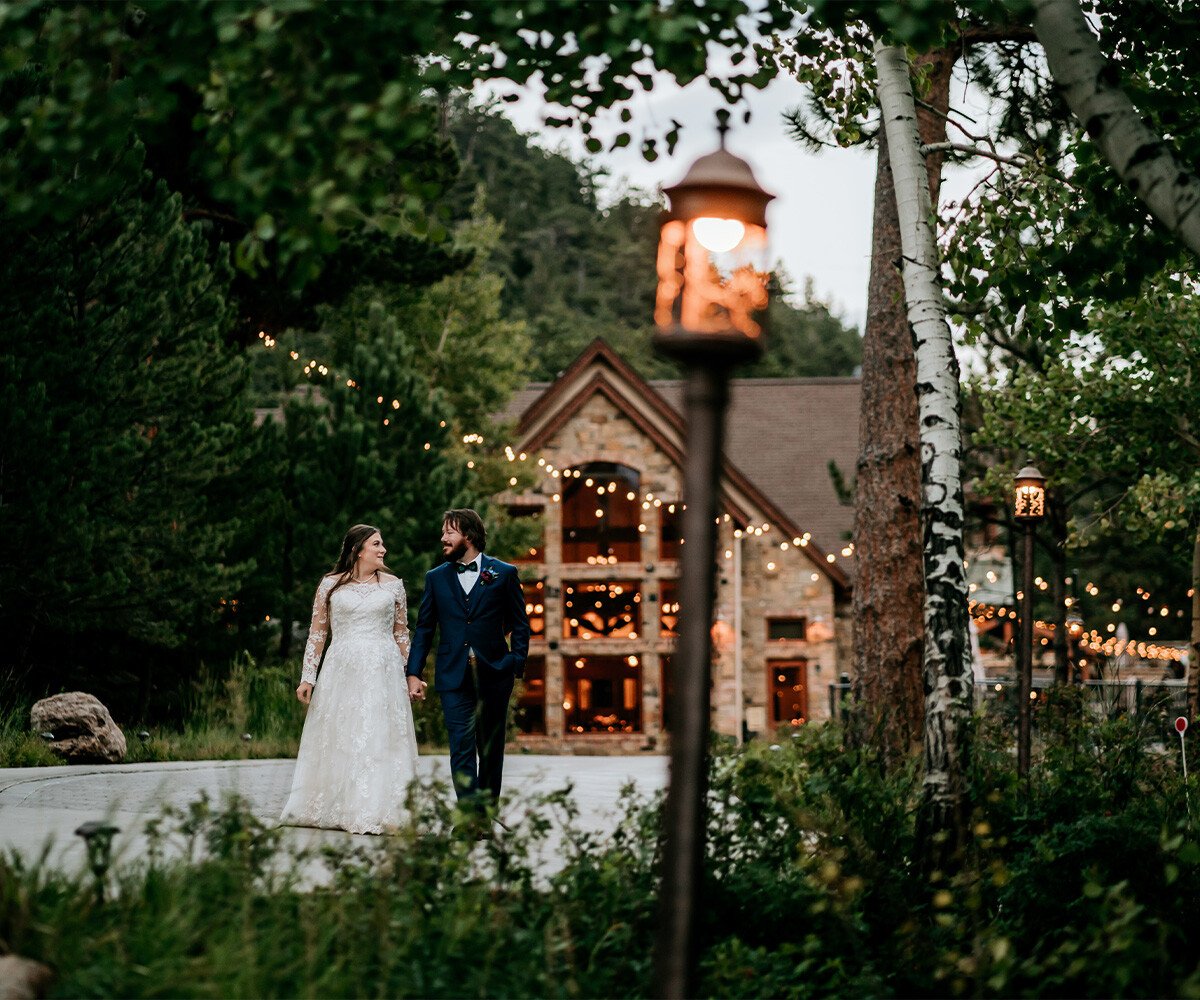 Couple walking among grounds at Della Terra by Wedgewood Weddings