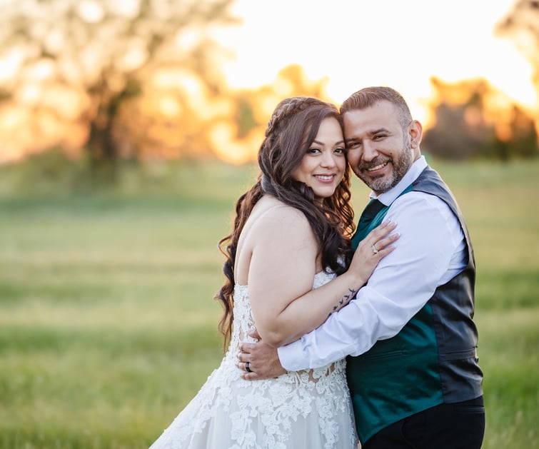 Bride and groom posing at sunset in green field - Evergreen Springs by Wedgewood Weddings - 16