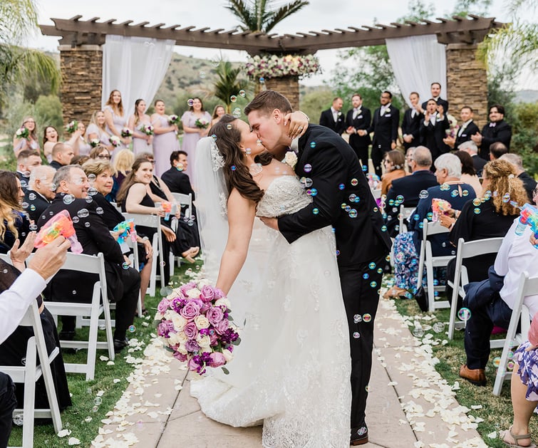 Couple at ceremony with bubbles, Fallbrook Estate by Wedgewood Weddings