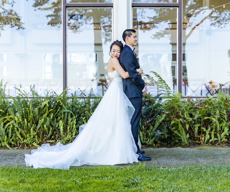 Bride hugging groom before first look - Golden Gate Club at the Presidio - Wedgewood Weddings - 1