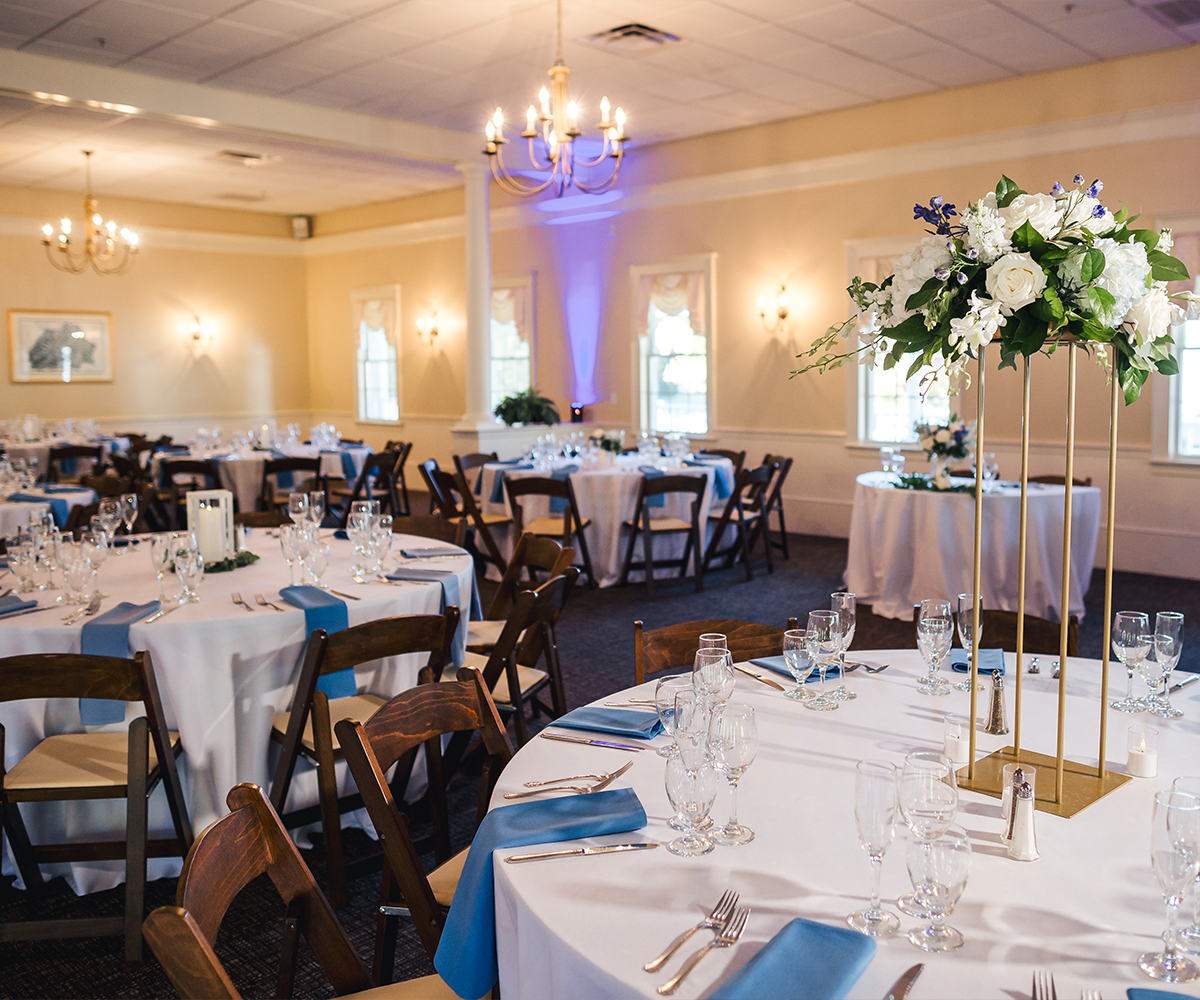 Elegant reception setup with gold and blue accents - Groveland Fairways by Wedgewood Weddings