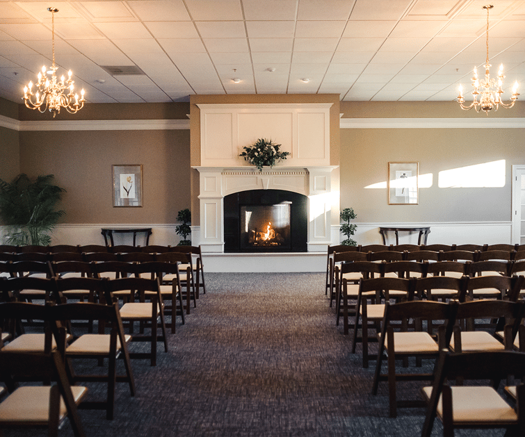 Indoor ceremony with fireplace - Groveland Fairways by Wedgewood Weddings