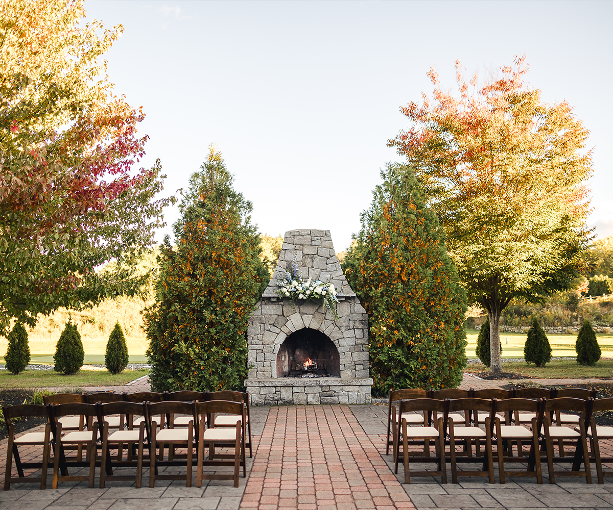 Stunning outdoor fireplace ceremony at Groveland Fairways by Wedgewood Weddings